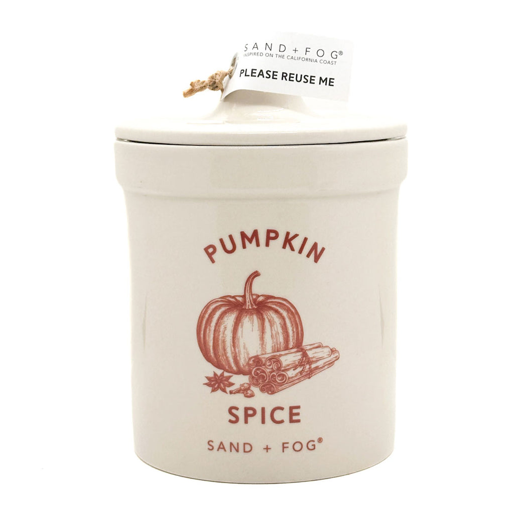 SAND + FOG Pumpkin spice candle in a ceramic container with lid on a white background