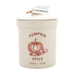 SAND + FOG Pumpkin spice candle in a ceramic container with lid on a white background