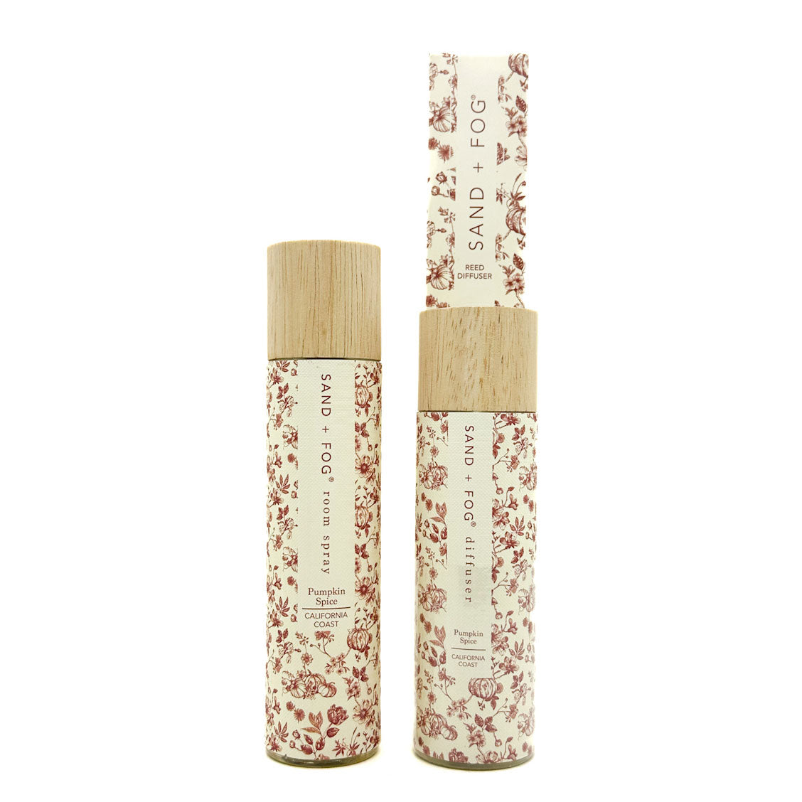 SAND + FOG Pumpkin Spice Room Spray & Reed Diffuser floral-patterned bottles with wooden caps on a white background