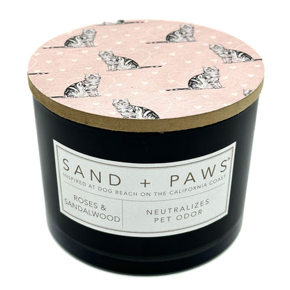 Roses & Sandalwood Candle with 'Sand + Paws' label and cat pattern on lid