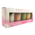 Sand + Fog candle set packaging with four candles inside on a white background