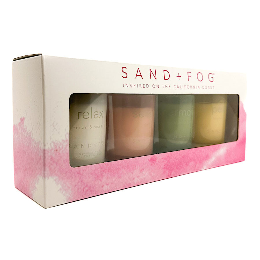 Sand + Fog candle set packaging with four candles inside on a white background