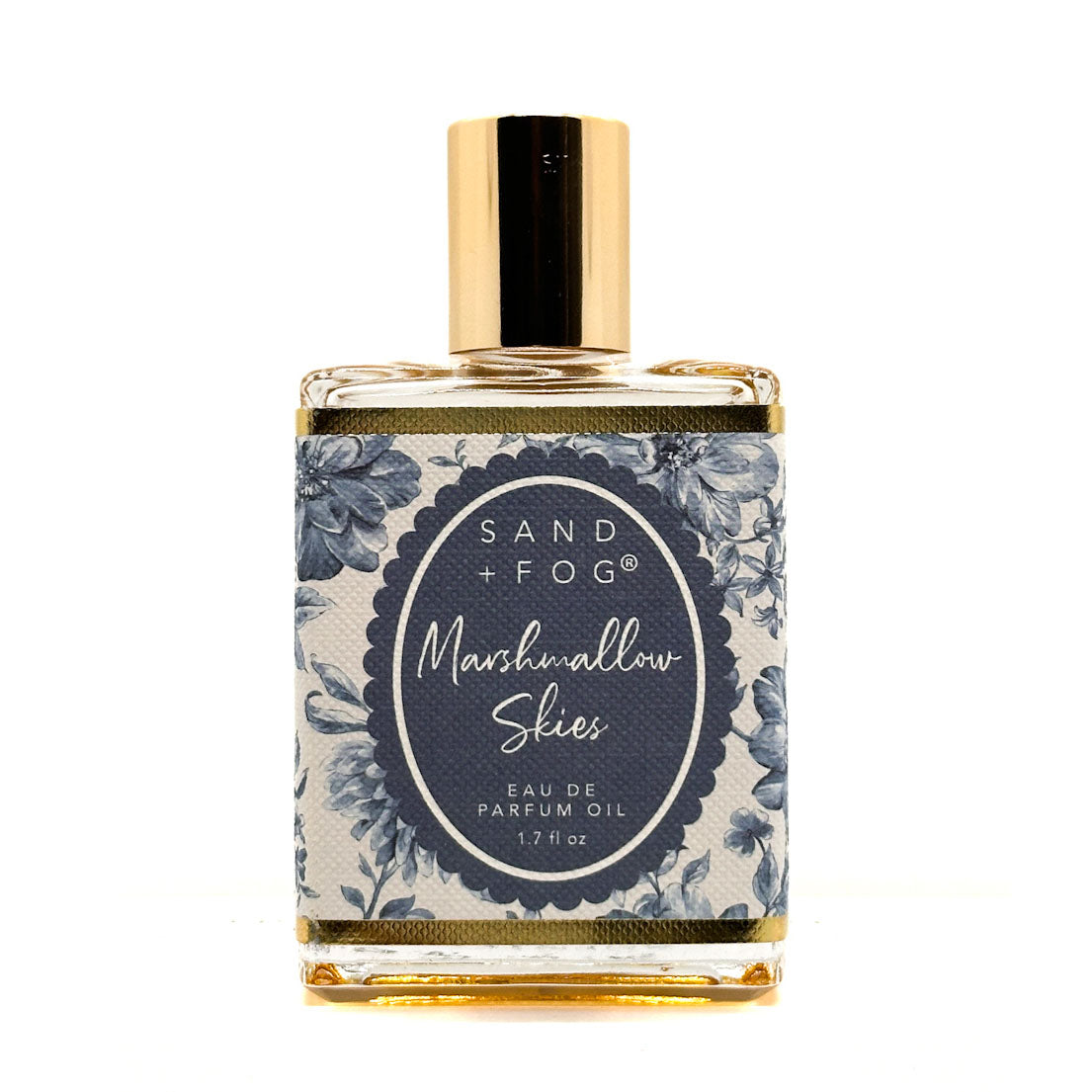 SAND + FOG Eau De Parfum Oil bottle with floral label on a white background