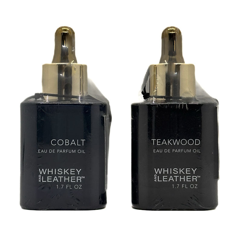 Two black bottles of Whiskey and Leather Eau de Parfum Oil, one labeled 'Cobalt' and the other 'Teakwood', on a white background.