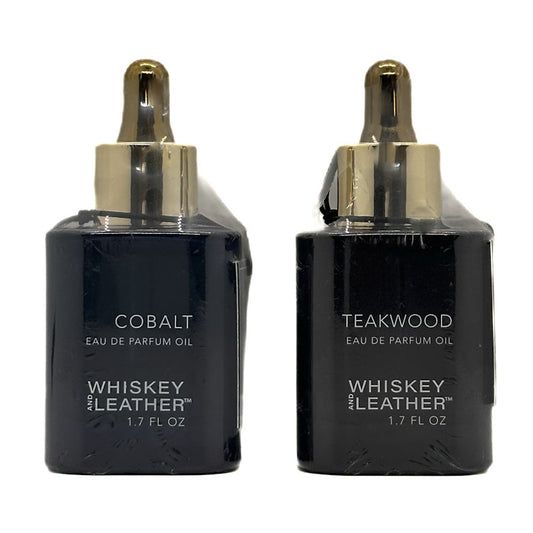Two black bottles of Whiskey and Leather Eau de Parfum Oil, one labeled 'Cobalt' and the other 'Teakwood', on a white background.