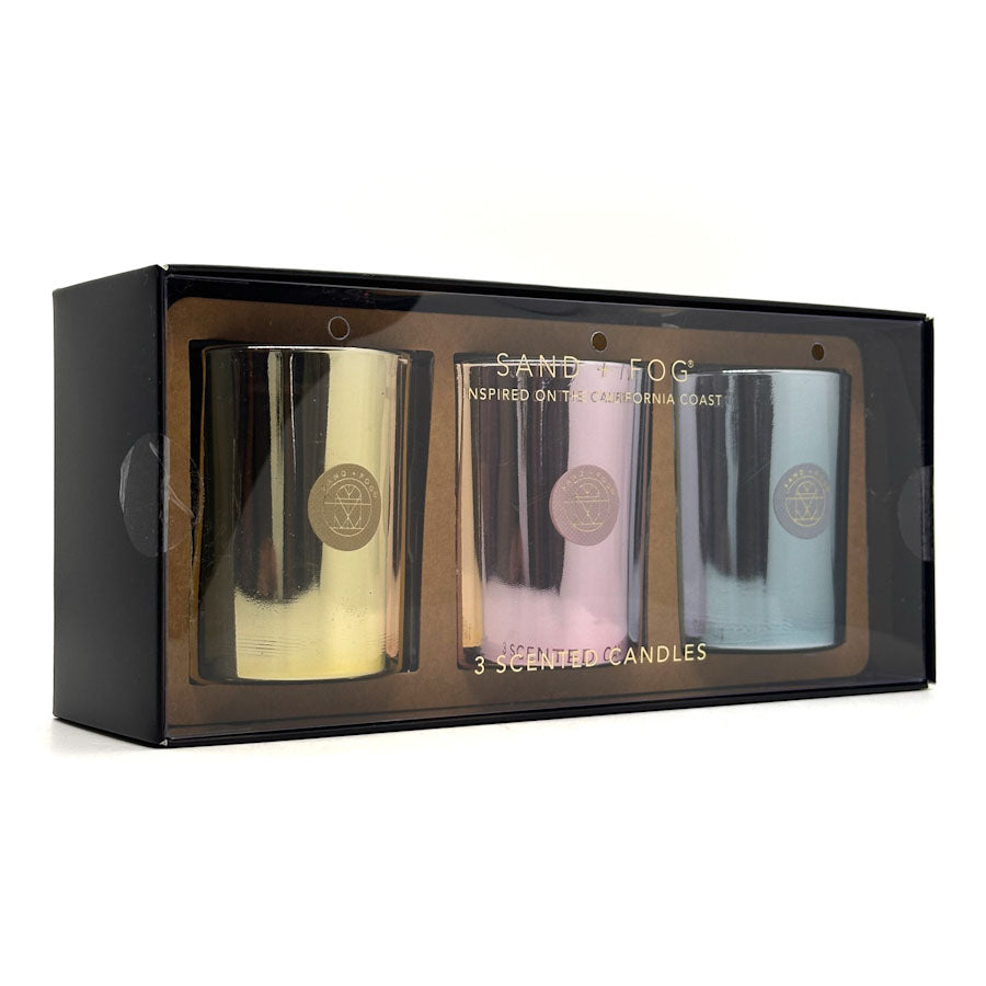 Set of three scented candles in a black box with 'SAND FOG' branding.
