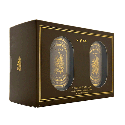 Two MWG candles in a decorative box labeled 'Santal Vanilla' on a white background.