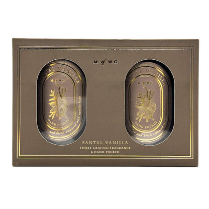 Two MWG candles in a decorative box labeled 'Santal Vanilla' on a white background.