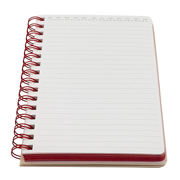 Notebook with red wire binding on a white background