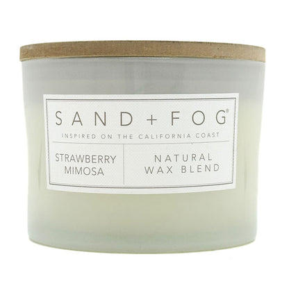 Strawberry Mimosa Candle with 'Sand + Fog' label on a white background