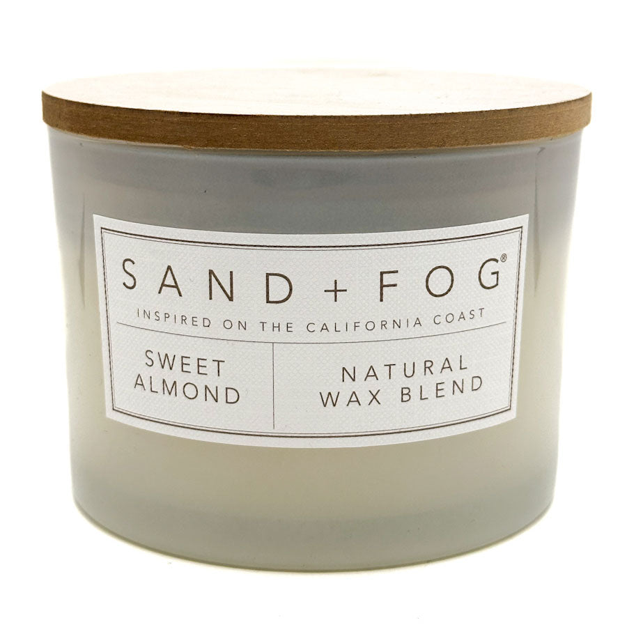 Sweet Almond Candle with 'Sand + Fog' label on a white background