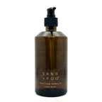 Brown bottle of Sand + Fog Tahitian Vanilla hand wash on a white background