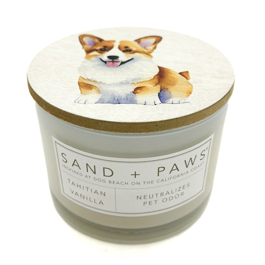 Tahitian Vanilla Candle with a dog illustration on the lid and 'Sand + Paws' branding.