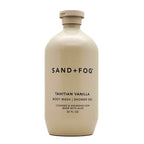 Beige bottle of Sand + Fog Tahitian Vanilla body wash on a white background