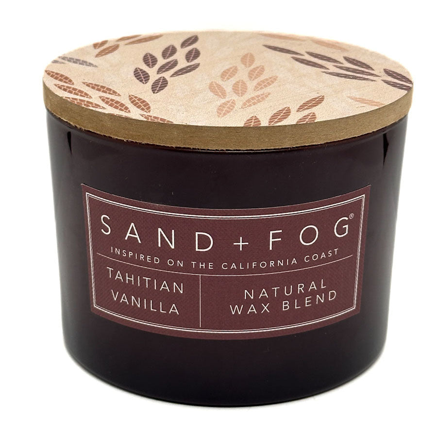 Tahitian Vanilla Sand + Fog candle with a decorative lid on a white background