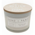 Tahitian Vanilla candle with a wooden lid labeled 'Sand + Paws' on a white background