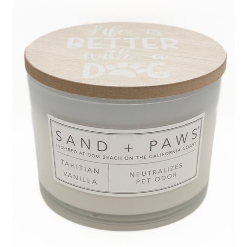 Tahitian Vanilla candle with a wooden lid labeled 'Sand + Paws' on a white background