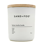White candle with a wooden lid labeled 'SAND + FOG Tahitian Vanilla Candle' on a white background