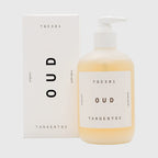 Bottle and box of TGC 301 Oud fragrance body wash on a white background
