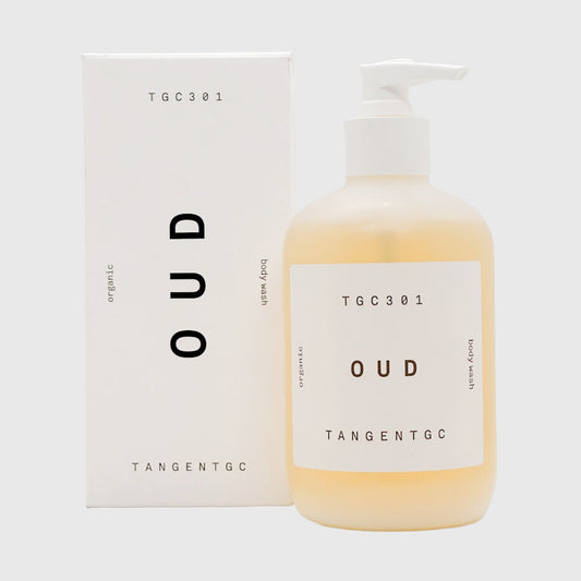 Bottle and box of TGC 301 Oud fragrance body wash on a white background