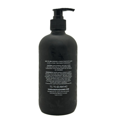 Black bottle with pump and text on a white background