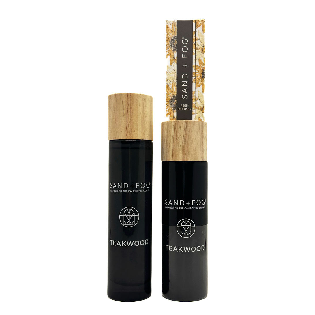 Teakwood room spray + reed diffuser with wooden caps and 'Sand + Fog' branding on a white background.