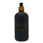 SAND + FOG Teakwood black liquid soap bottle with gold text on a white background