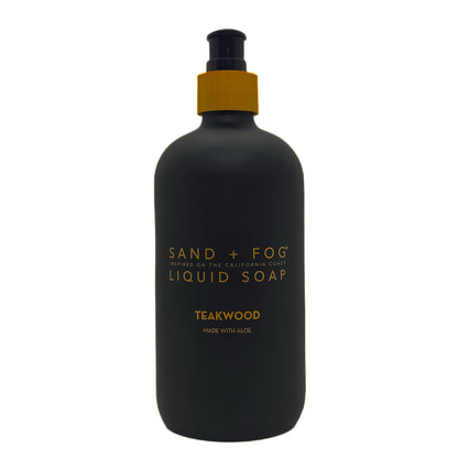 SAND + FOG Teakwood black liquid soap bottle with gold text on a white background