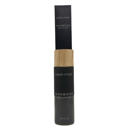 Black and wood Teakwood reed diffuser bottle labeled 'Sand + Fog' on a white background