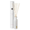 The Ritual of Sakura 250ml White diffuser with wooden sticks and packaging on a white background