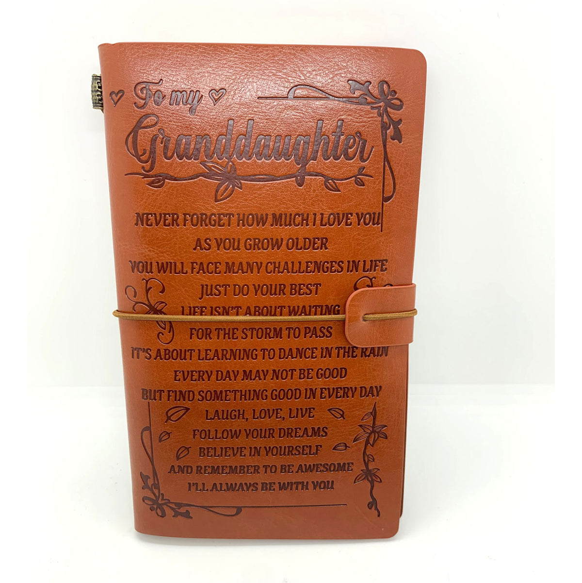 Brown leather journal with engraved message for granddaughter on a white background