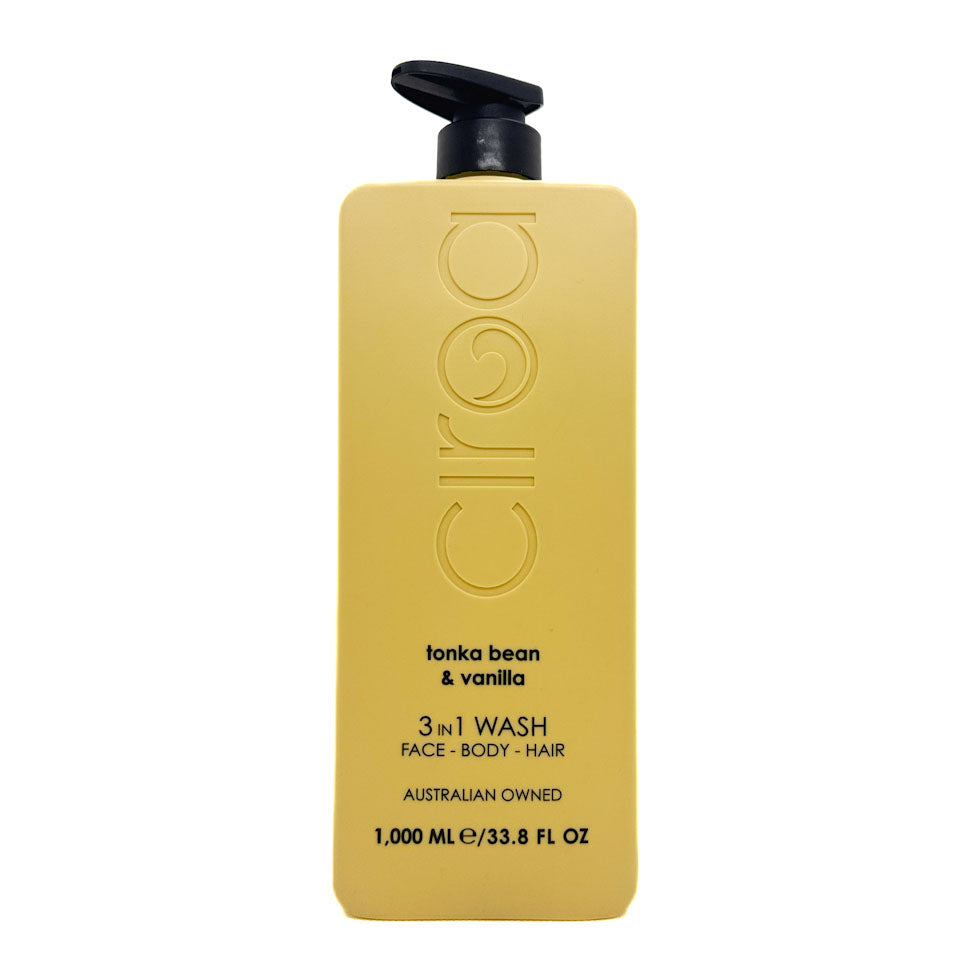 A 1000 mL bottle of Ciroc Face, Body, and Hair 3-in-1 Wash in 'tonka bean & vanilla' scent. The bottle is a matte mustard yellow with a black pump dispenser on top, set against a plain white background.