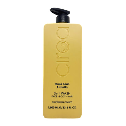 A 1000 mL bottle of Ciroc Face, Body, and Hair 3-in-1 Wash in 'tonka bean & vanilla' scent. The bottle is a matte mustard yellow with a black pump dispenser on top, set against a plain white background.