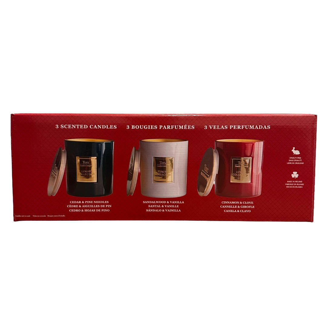Torc candle Company set of three seasonal holiday candles in a red box.