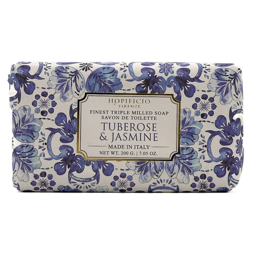 A rectangular bar of HOpificio Firenze tuberosse & jasmine toilet soap, featuring a blue and purple floral pattern on a white background with a central cream-colored label.