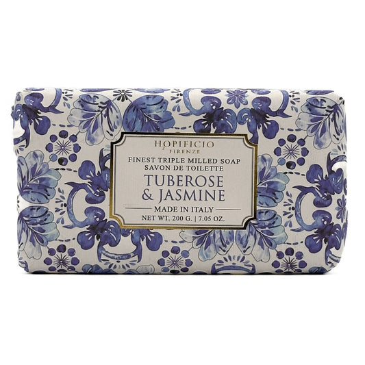 A rectangular bar of HOpificio Firenze tuberosse & jasmine toilet soap, featuring a blue and purple floral pattern on a white background with a central cream-colored label.