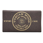 Bar of Tuscan Wood soap with brown packaging and gold text on a white background