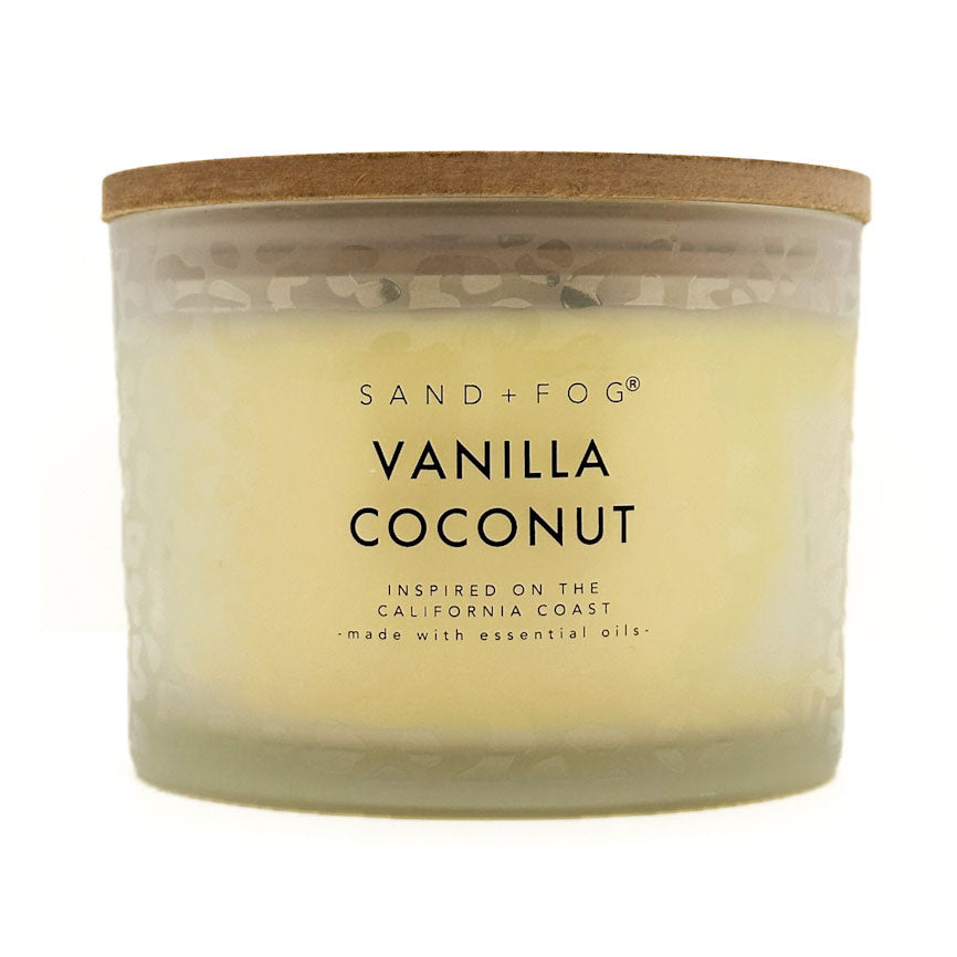 SAND + FOG Vanilla Coconut candle with wooden lid on a white background