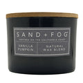 Grey vanilla pumpkin candle with a wooden lid and 'Sand + Fog' label on a white background