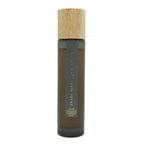 Bottle of Vanilla Sandalwood room spray with a wooden cap on a white background