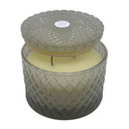 Vanilla Sandalwood decorative candle by SAND + FOG in a textured glass jar with a lid on a white background