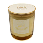 Vanilla Brûlée candle with a gold lid on a white background