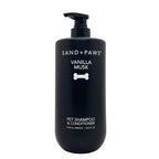 Black bottle of Sand + Paws Vanilla Musk pet shampoo and conditioner on a white background
