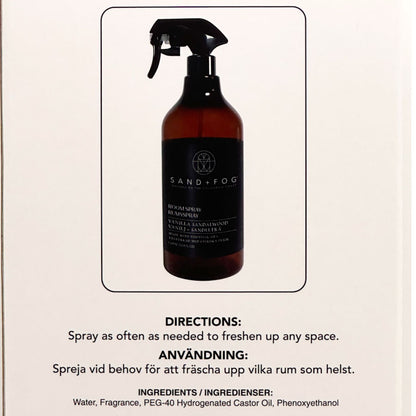 Brown spray bottle with black label on a beige background