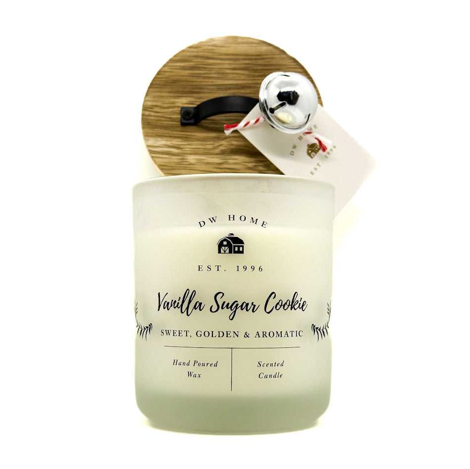 DW Home Scented candle with a wooden lid and vanilla sugar cookie label on a white background