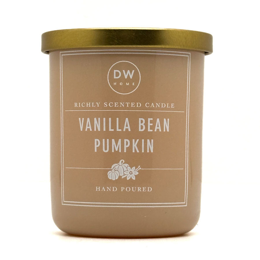 A DW Home Vanilla Bean Pumpkin scented candle in a matte taupe jar with a metallic gold lid, shown on a clean white background.