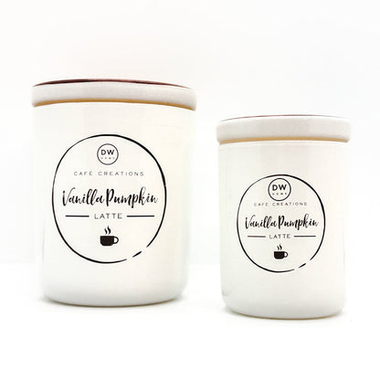 Two white ceramic candles with matching lids, labeled 'Vanilla Pumpkin Latte' by Cafe Creations, on a clean white background.