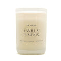 A frosted glass jar candle with creamy off-white wax, featuring a white lid and black text that reads 'DW HOME VANILLA PUMPKIN' on the front label.