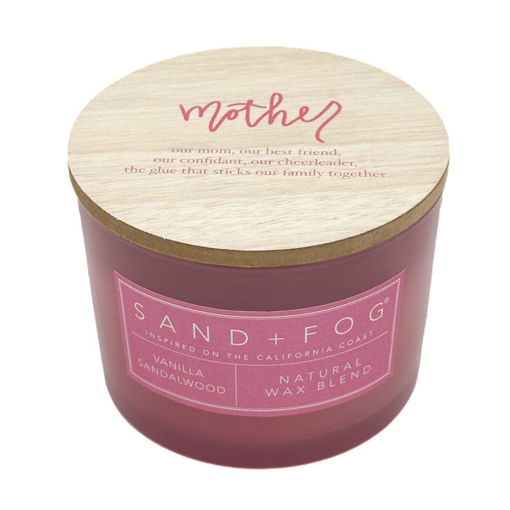 Pink candle with wooden lid featuring 'Mother' text and Sand + Fog branding.