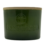 Velvet Pear green candle jar with 'Sand + Fog' branding on a white background